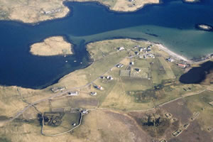 S9.1 Aerial view of Papil Burra. St. Lawrence's Church with its square kirkyard is in the centre of the picture (Shetland Museum) - click for a larger image